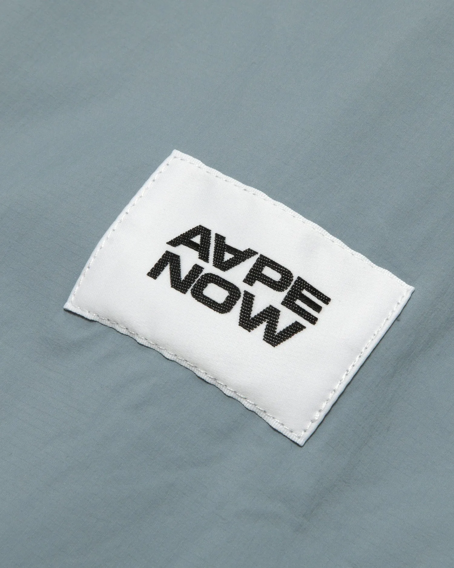 AAPENOW moonface logo windbreaker jacket